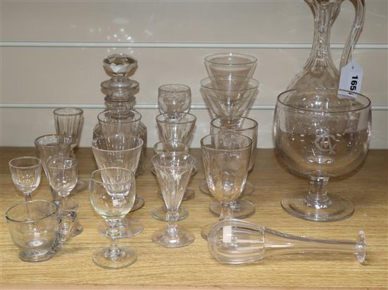 A group of assorted glassware including a claret jug, toddy lifter, decanters etc.